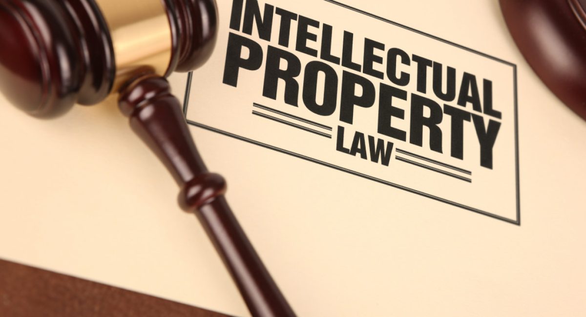 Intellectual property law written on a piece of paper with a gavel on it.